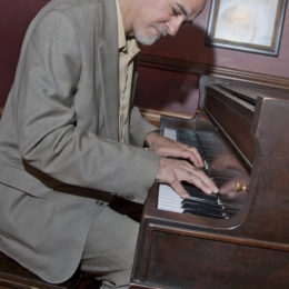 kahn playing piano two